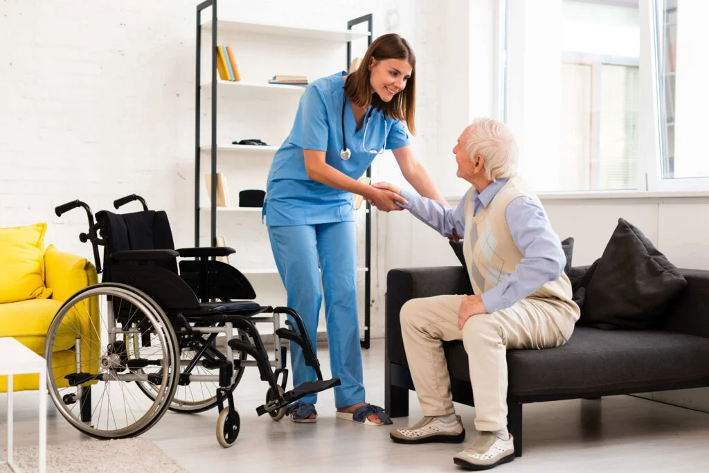 long-shot-nurse-helping-old-man-getting-up